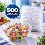Capa elástica Fresh Cap da Decoricasa cobrindo tigela com frutas frescas e pacote de capas ao fundo na cozinha