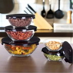 Conjunto de 5 potes de vidro Decoricasa com tampas pretas, organizados em uma bancada de cozinha.